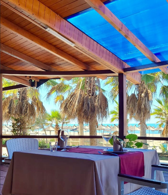 Sunshine Spille terrace overlooking the beach